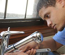 Loyd, one of our Kirkland plumbers is repairing a kitchen sink