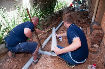 two of our plumbers are working on a trenhless sewer repair