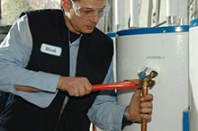 Mark is repairing a water heater